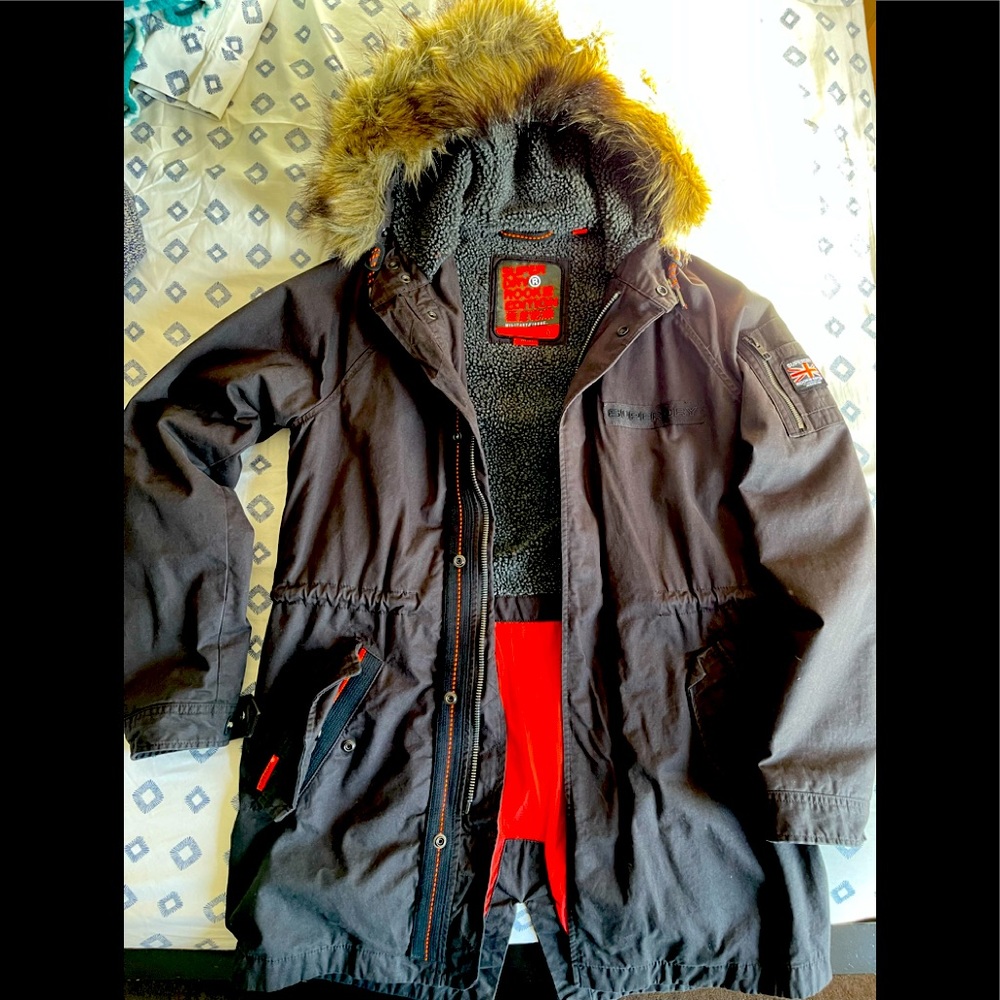 Fleece lined jacket with faux fur lined hood